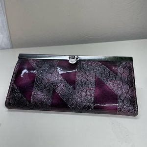 Quality wallet with many compartments Purple laycra w/metal clasp